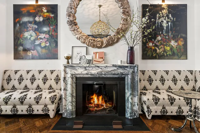 a living room with furniture large window and a table