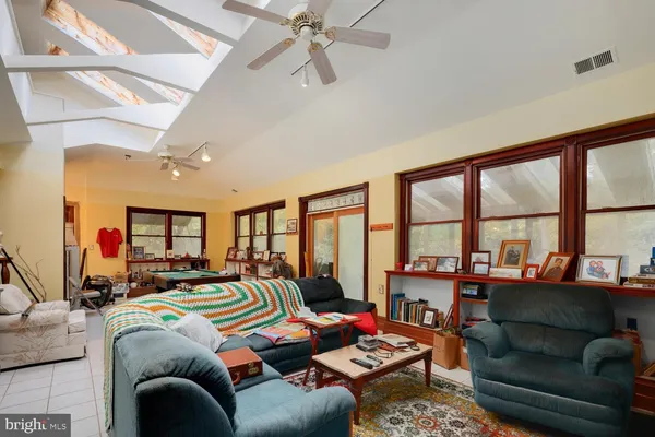 a bed room with furniture and a large window