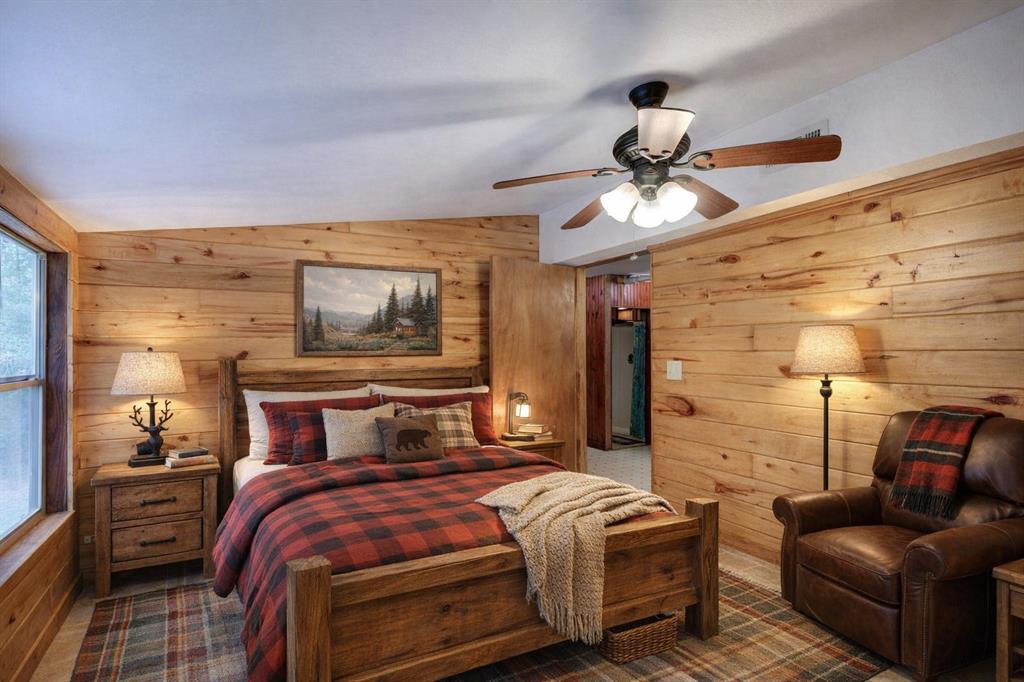 1267 Johnson Road Doyline, LA 71023 - Photo 6 of 19 a bedroom with a bed and wooden floor