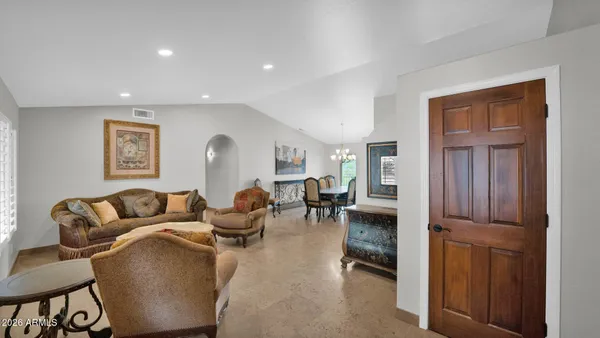 a living room with furniture and a window