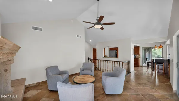 a kitchen with stainless steel appliances granite countertop a refrigerator and a stove