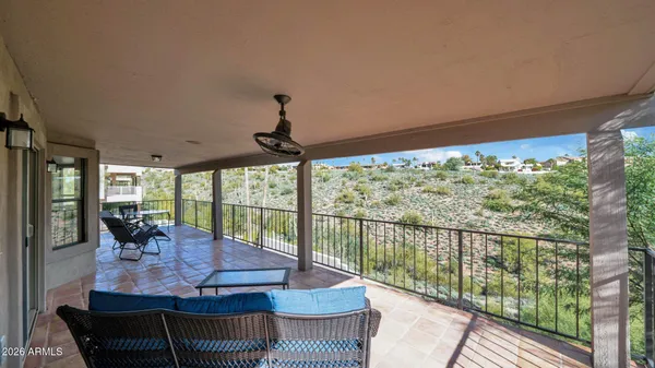 a view of a swimming pool with a balcony