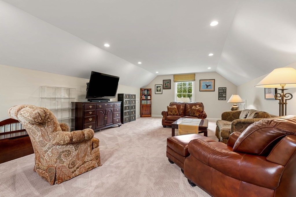 4 Point Shore Overlook Amesbury, MA 01913 - Photo 31 of 42 a living room with furniture and a flat screen tv