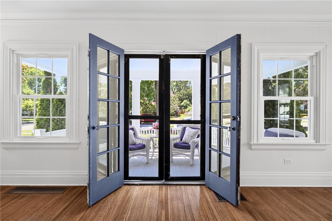 138 Dorchester Road Rochester, NY 14610 - Photo 14 of 41 Living Room also leads to the front sitting porch through French doors & screen doors! What a gorgeous view!