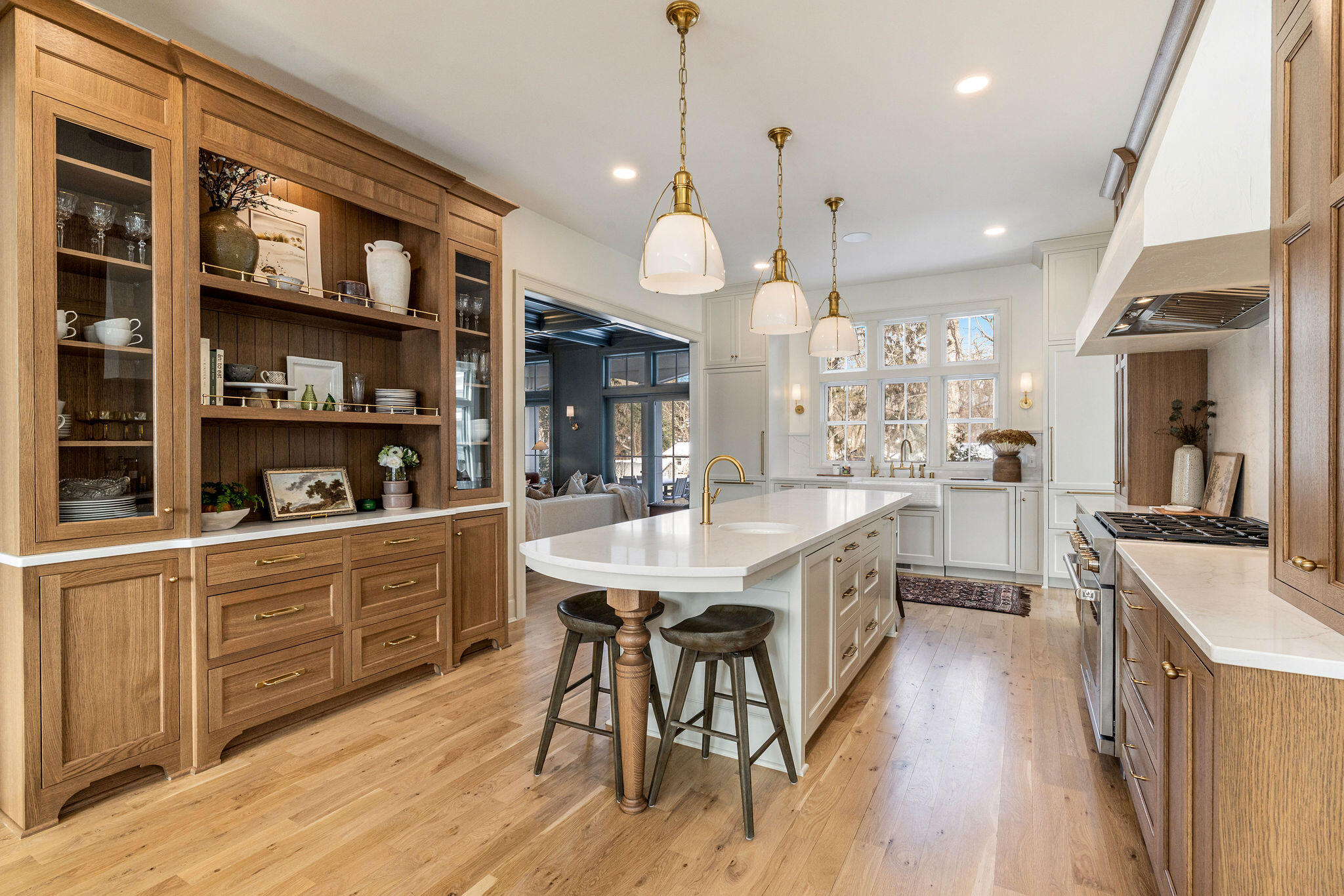 545 Wisconsin Avenue Delafield, WI 53018 - Photo 5 of 24 The family chef will love the space with high-end appliances, quartz countertops, and large built-in hutch.