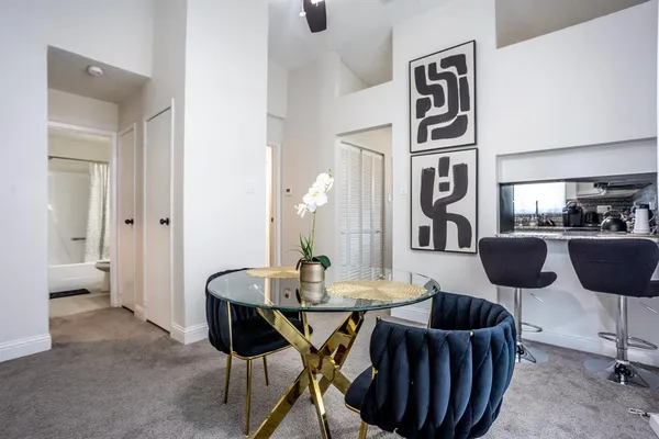 a dining room with furniture and window