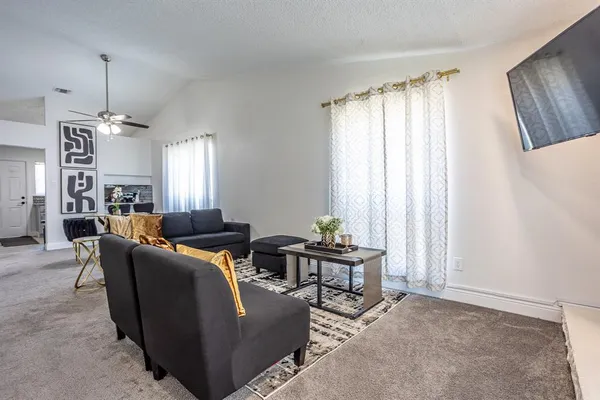 a living room with furniture and a window