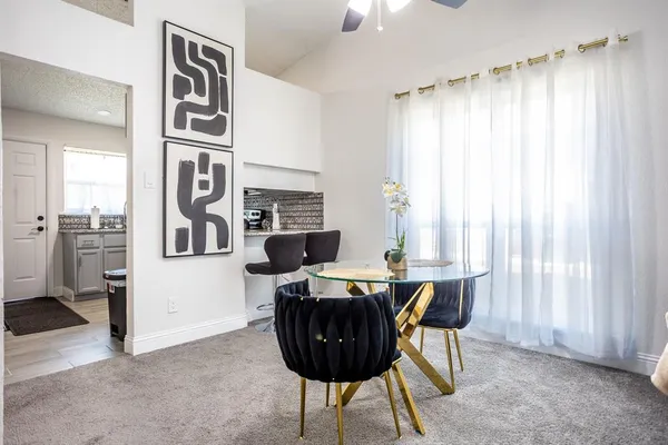 a view of a dining room with furniture window and outside view