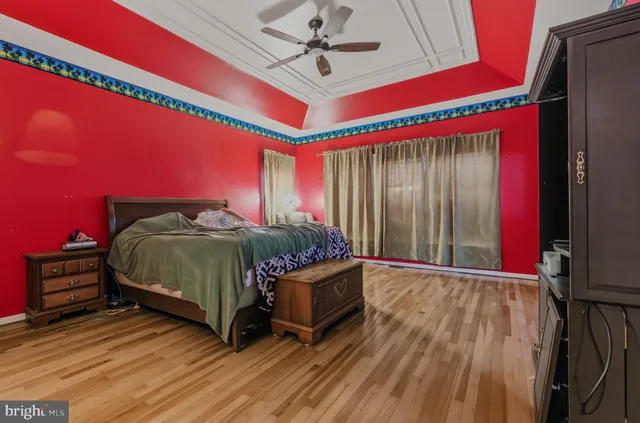 a bathroom with a toilet sink and shower curtain