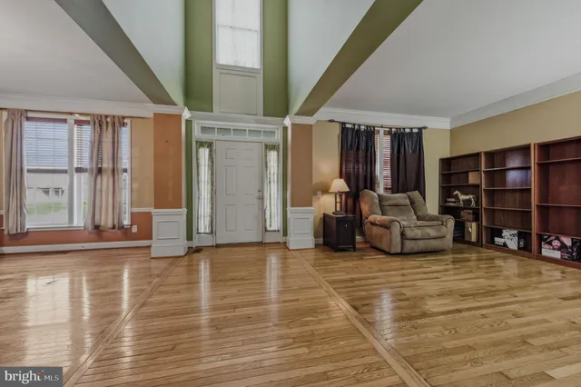 a view of a livingroom with furniture and front door