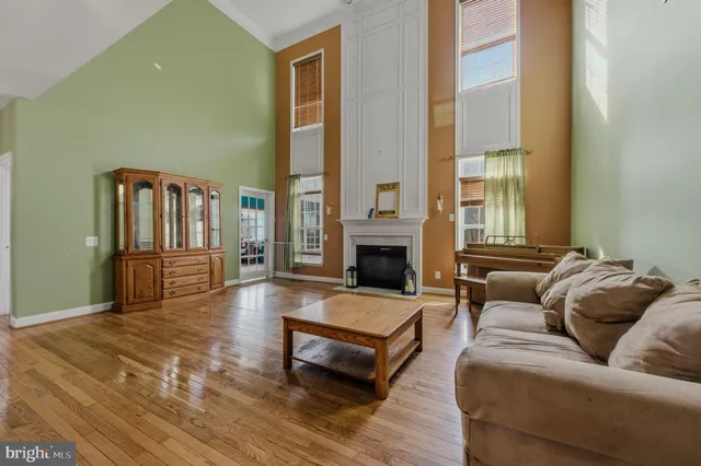 a view of living room with furniture and a fireplace