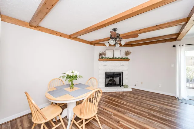 a view of an empty room with a fireplace