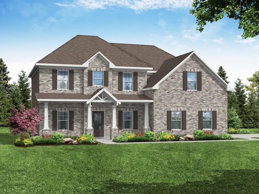 1101 Longleaf Trace Monroe, GA 30656 - Photo 1 of 1 a front view of a house with a yard and garage