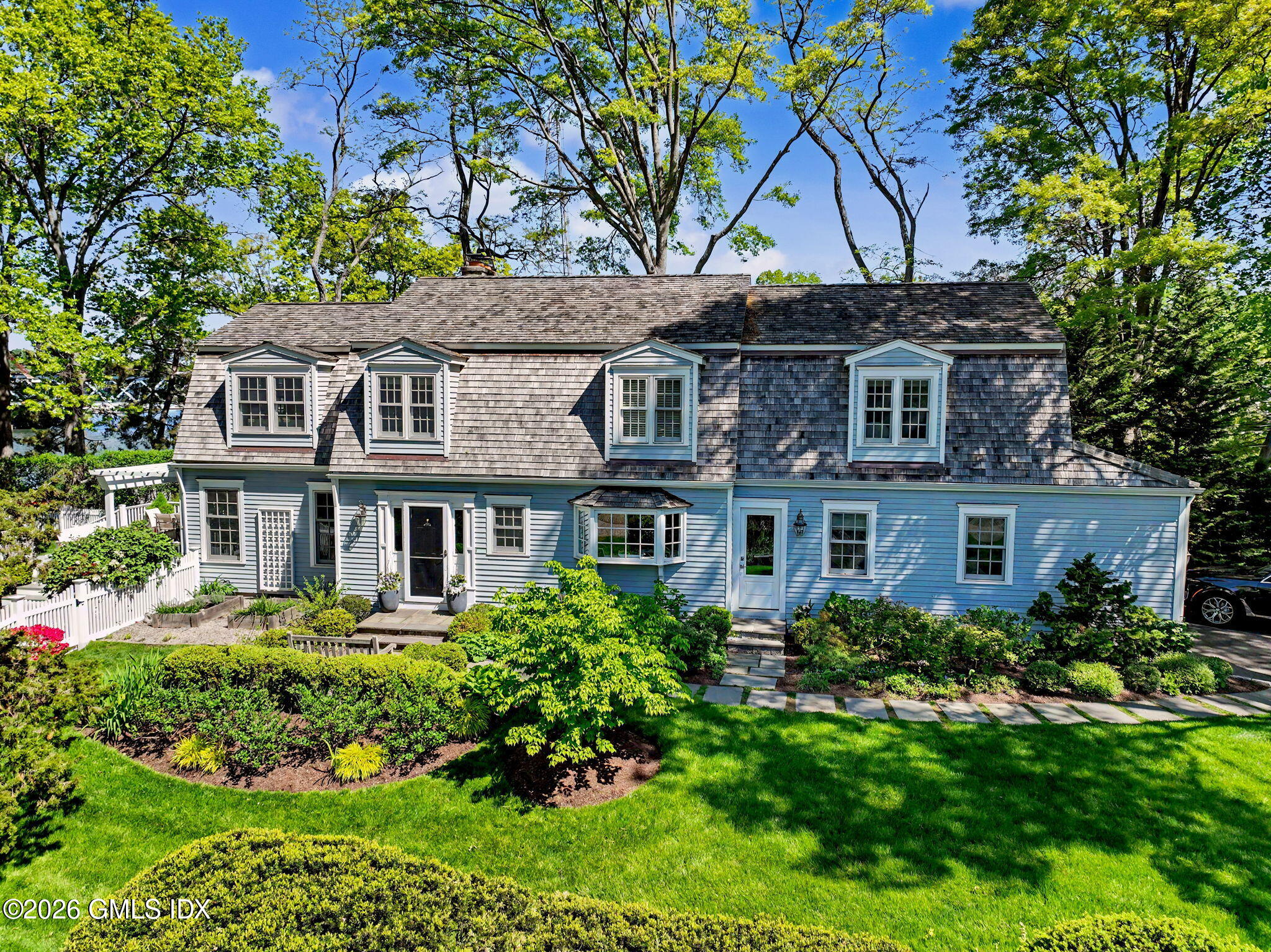 10 Newton Street Riverside, CT 06878 - Photo 26 of 28 a front view of a house with a garden