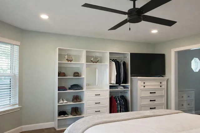 a view of a bedroom with a bed and closet