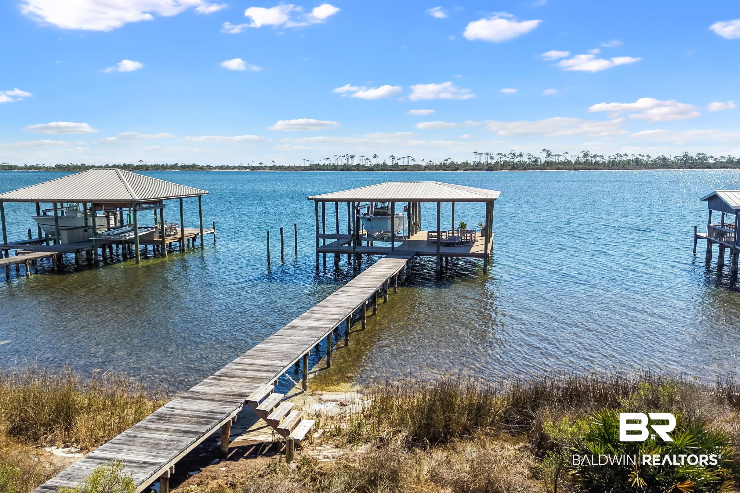 32620 River Road Orange Beach, AL 36561 - Photo 48 of 60 Dock area featuring a water view and boat lift
