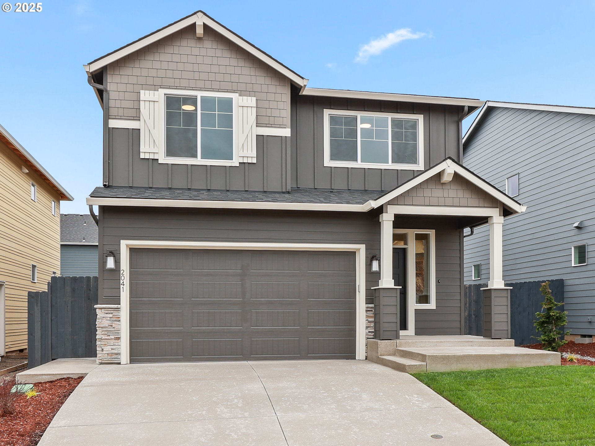 2041 Northwest 18th Avenue Battle Ground, WA 98604 - Photo 2 of 3 a front view of a house with a yard and garage