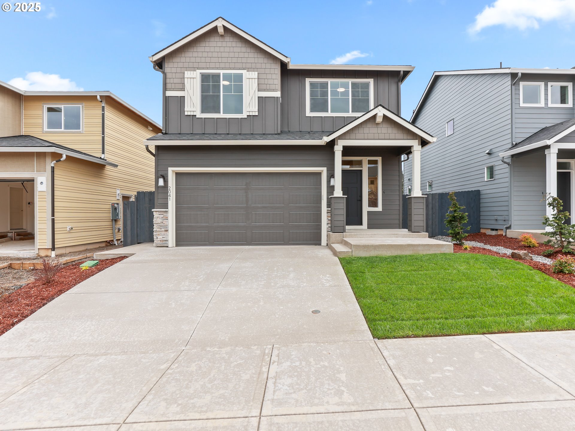 2041 Northwest 18th Avenue Battle Ground, WA 98604 - Photo 3 of 3 a front view of a house with a yard and garage