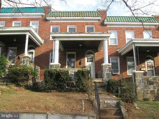 353 Marydell Road Baltimore, MD 21229 - Photo 1 of 20 a front view of a house with garden
