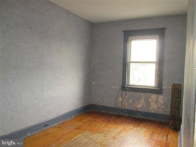 353 Marydell Road Baltimore, MD 21229 - Photo 11 of 20 a view of a small space with wooden floor and a window