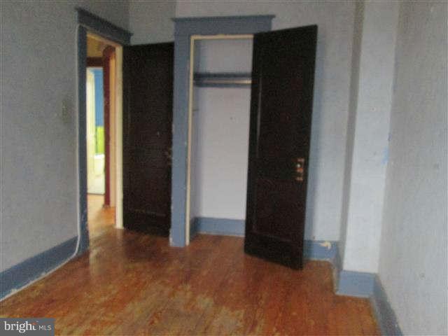 353 Marydell Road Baltimore, MD 21229 - Photo 12 of 20 wooden floor in an empty room