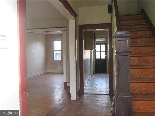353 Marydell Road Baltimore, MD 21229 - Photo 4 of 20 a view of a hallway with wooden floor and staircase