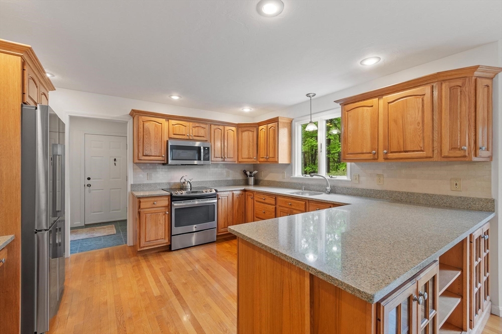 94 Turner Road Townsend, MA 01469 - Photo 10 of 42 a kitchen with stainless steel appliances granite countertop a stove a sink dishwasher and a refrigerator