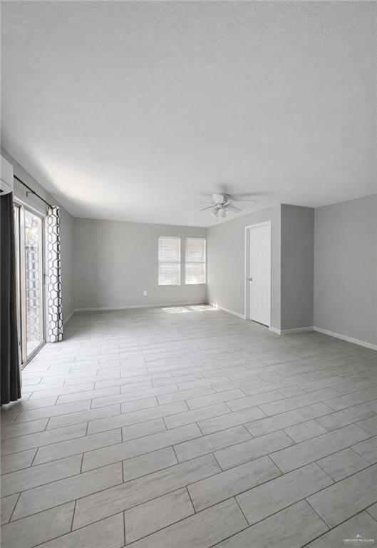 1403 North Shary Road Mission, TX 78572 - Photo 5 of 9 Spare room with a ceiling fan and baseboards