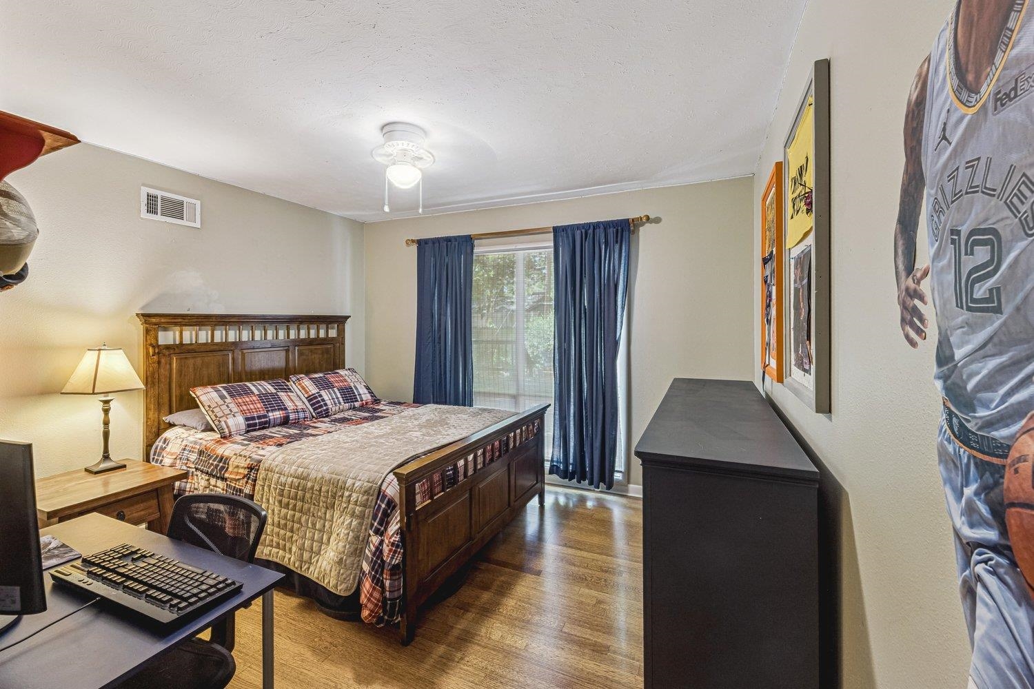 4220 Minden Road Memphis, TN 38117 - Photo 17 of 30 a bedroom with a bed and wooden floor