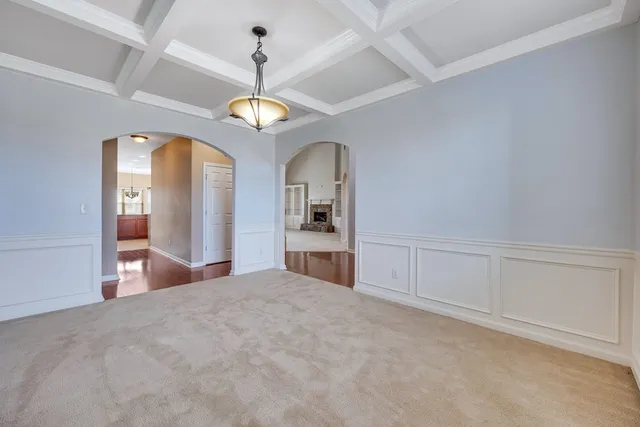a view of a kitchen with an empty space and ceiling fan