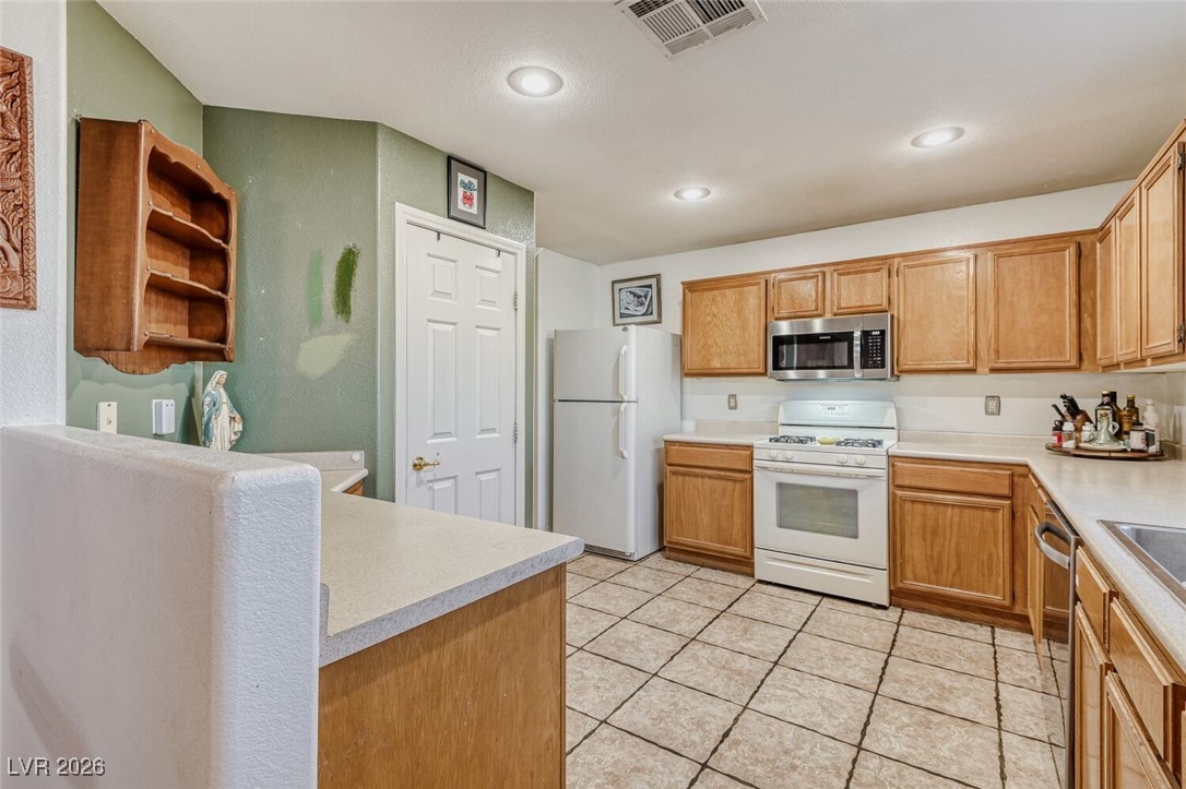 2046 Peacemaker Road Las Vegas, NV 89183 - Photo 6 of 17 Kitchen with Pantry, Recessed Lighting, Garden Window. All appliances included.