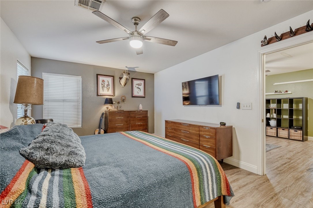 2046 Peacemaker Road Las Vegas, NV 89183 - Photo 10 of 17 Primary Bedroom with ceiling fan, good size walk-in closet, and private bathroom.