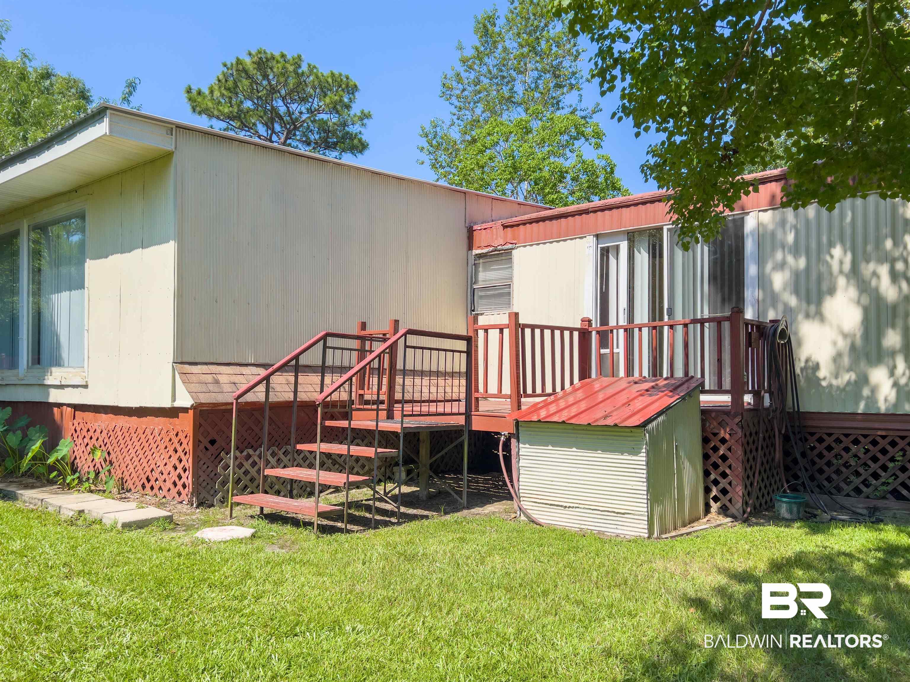 9190 County Road 97 Elberta, AL 36530 - Photo 11 of 53 Rear view of property with a yard and a wooden deck