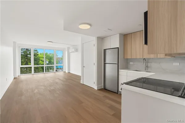 a view of a kitchen with a sink and a window
