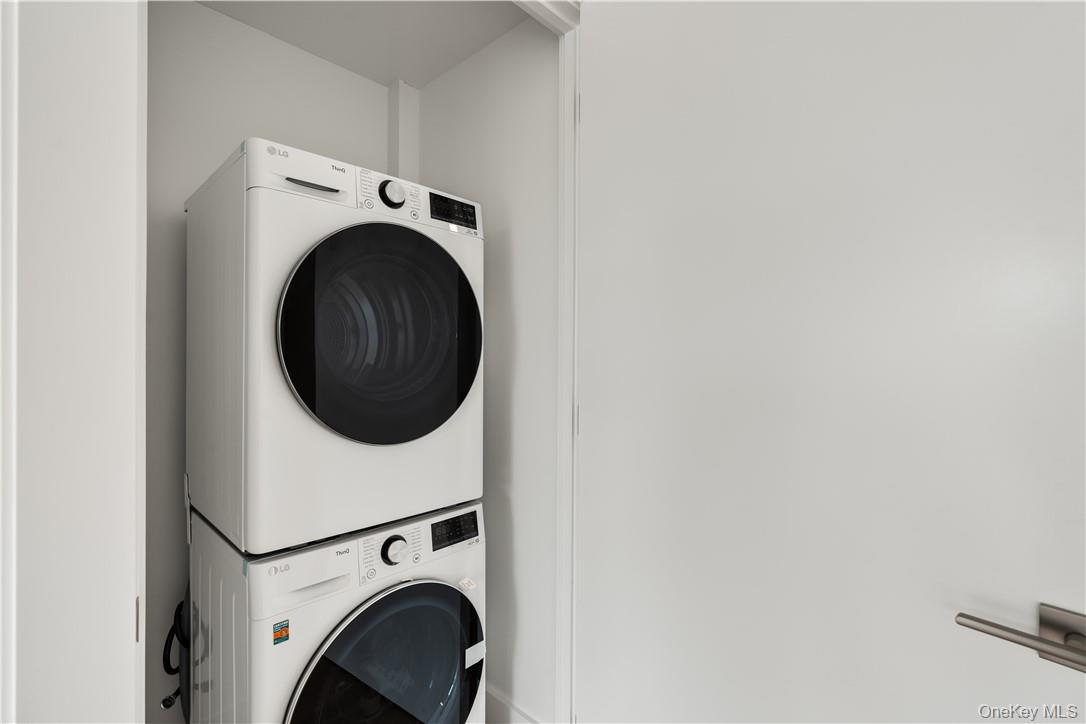10 Lyon Place, Unit 3J White Plains, NY 10601 - Photo 10 of 17 a utility room with dryer and washer