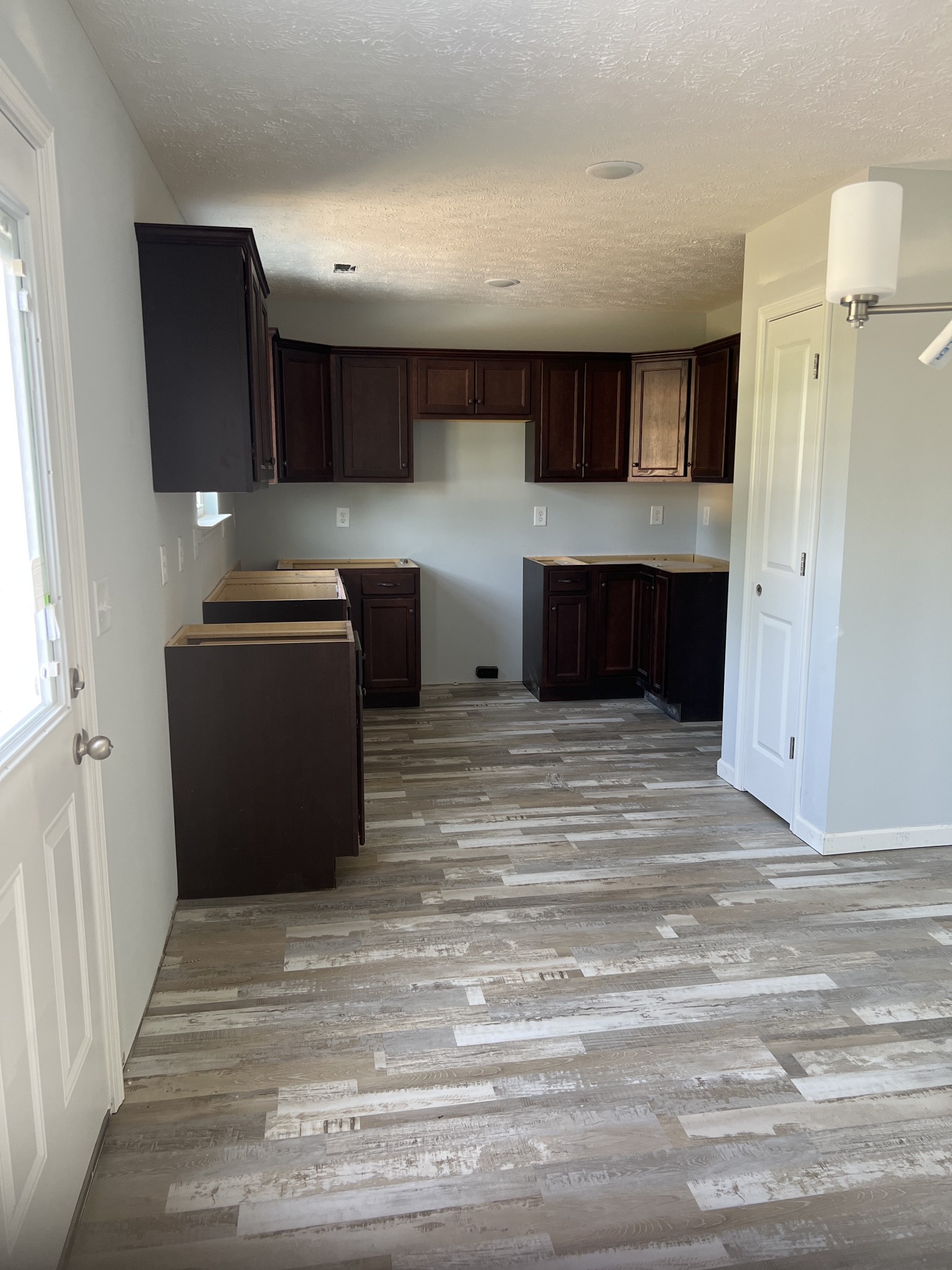 258 Timber Circle Manchester, TN 37355 - Photo 6 of 11 a view of a kitchen with cabinets and a ceiling fan