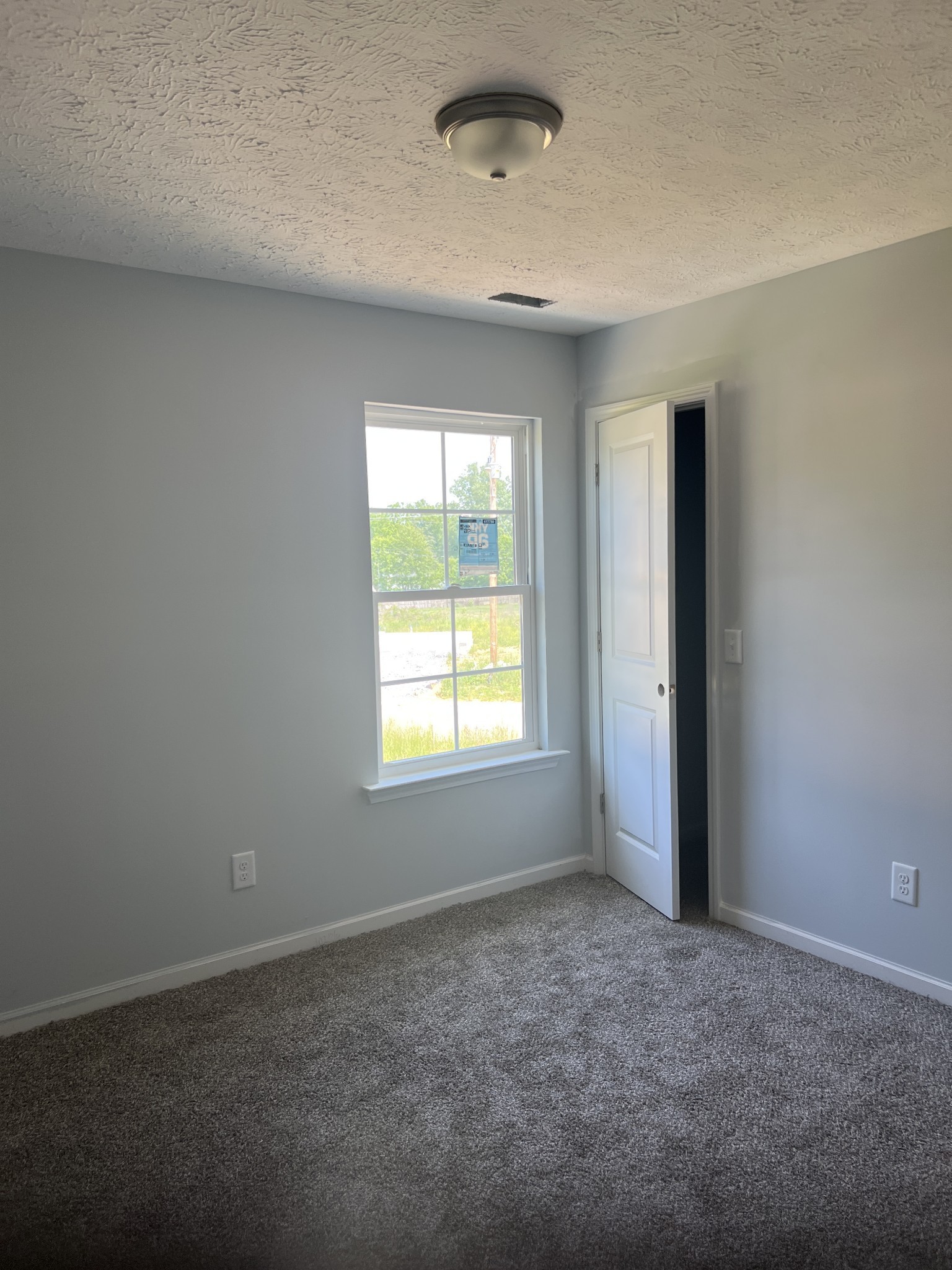 258 Timber Circle Manchester, TN 37355 - Photo 9 of 11 an empty room with a empty space and windows