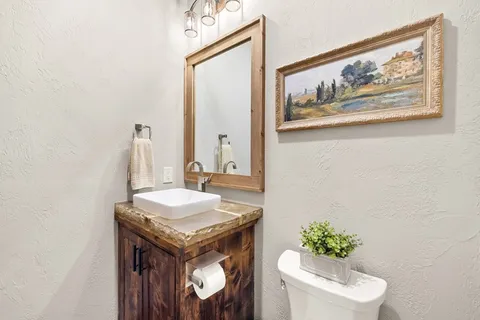 a bathroom with a toilet and a sink