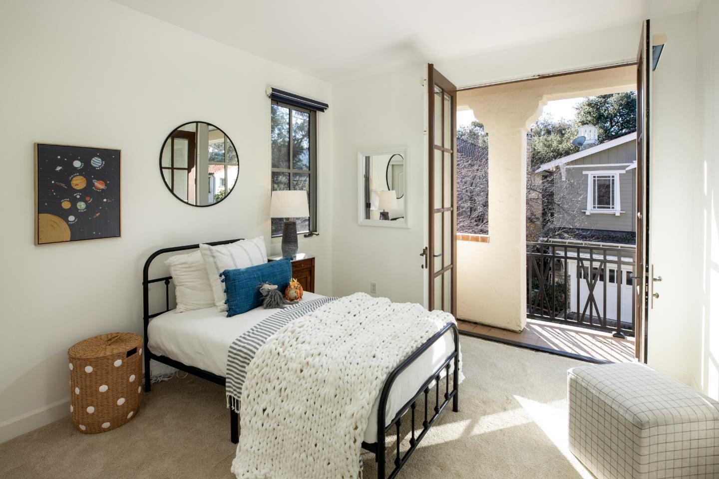119 Boyer Lane Los Gatos, CA 95030 - Photo 23 of 33 a bedroom with a bed a mirror on the wall and a large window
