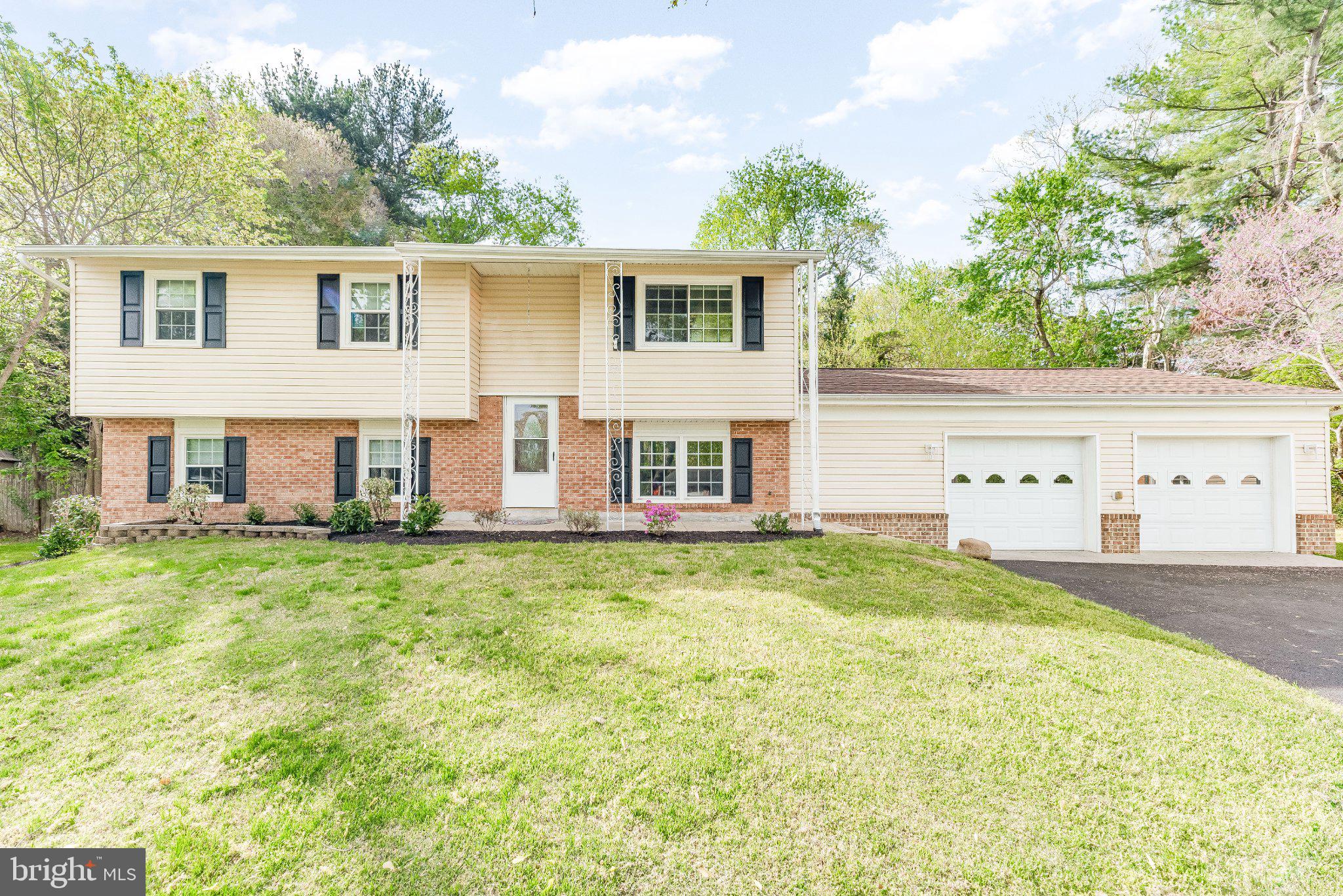 Charming split-level home with lush greenery.