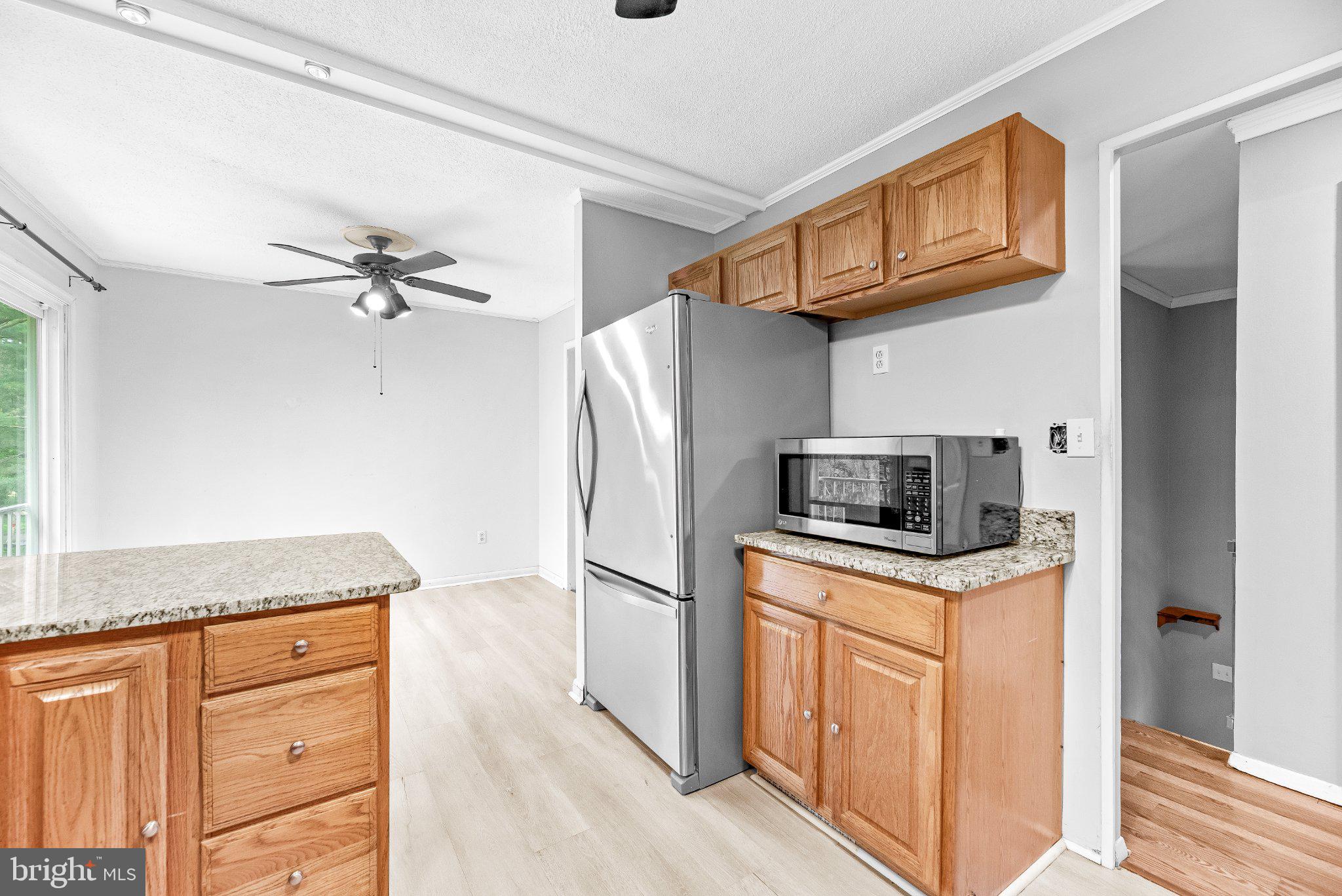 11951 Prince Court Dunkirk, MD 20754 - Photo 12 of 72 a kitchen with stainless steel appliances granite countertop a refrigerator a stove and a sink
