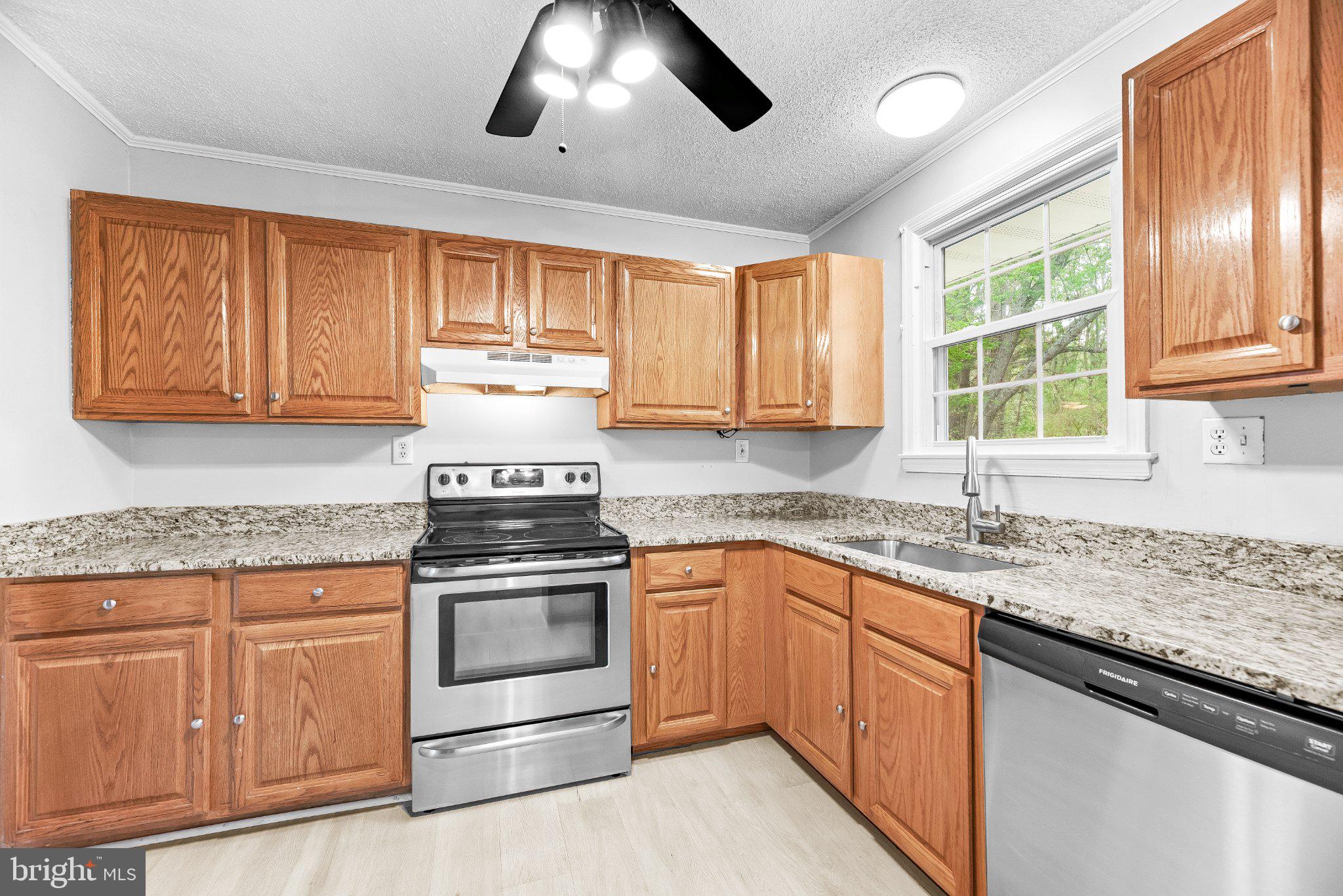 11951 Prince Court Dunkirk, MD 20754 - Photo 14 of 72 a kitchen with stainless steel appliances granite countertop a stove and a sink
