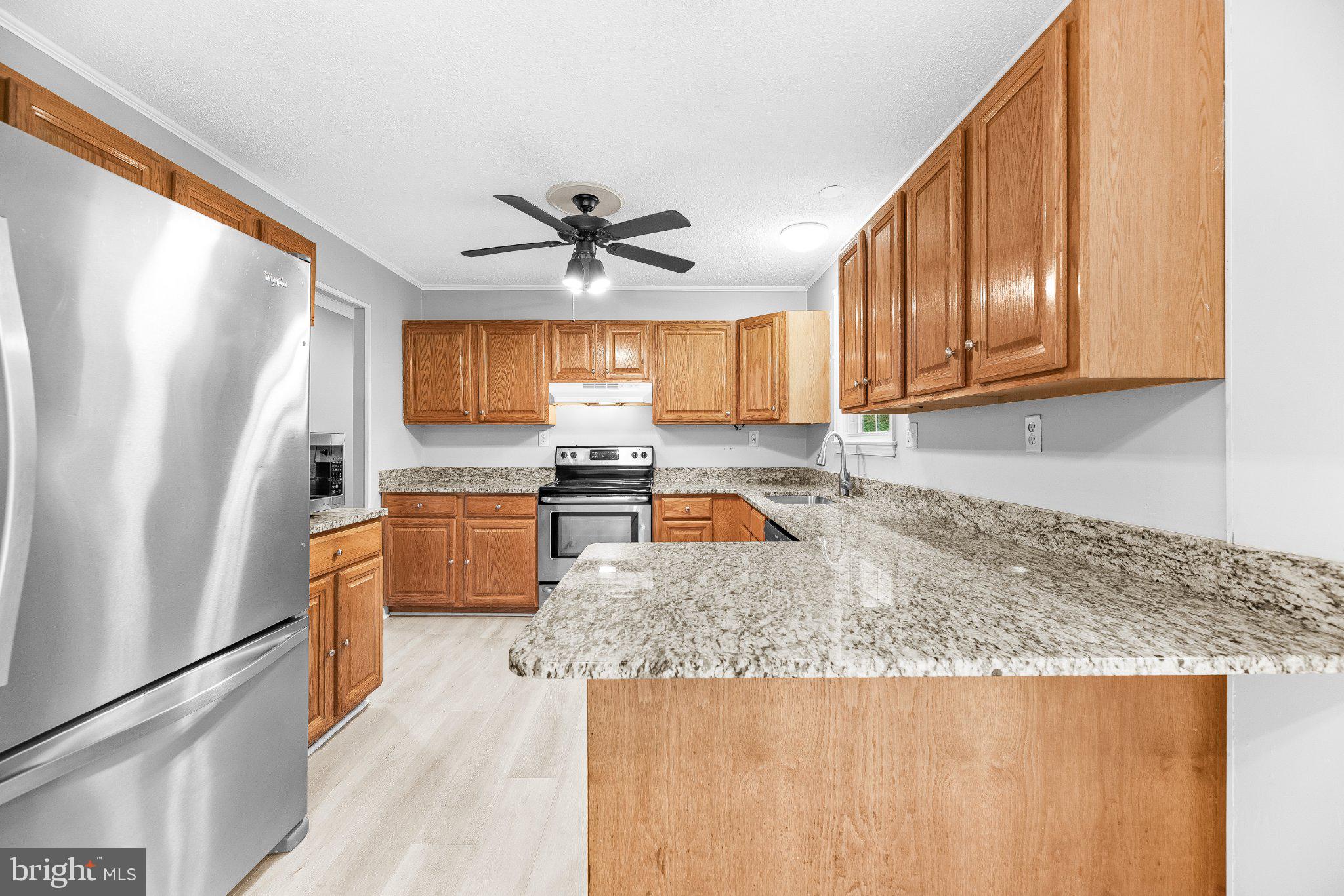 11951 Prince Court Dunkirk, MD 20754 - Photo 15 of 72 Modern kitchen with sleek finishes.