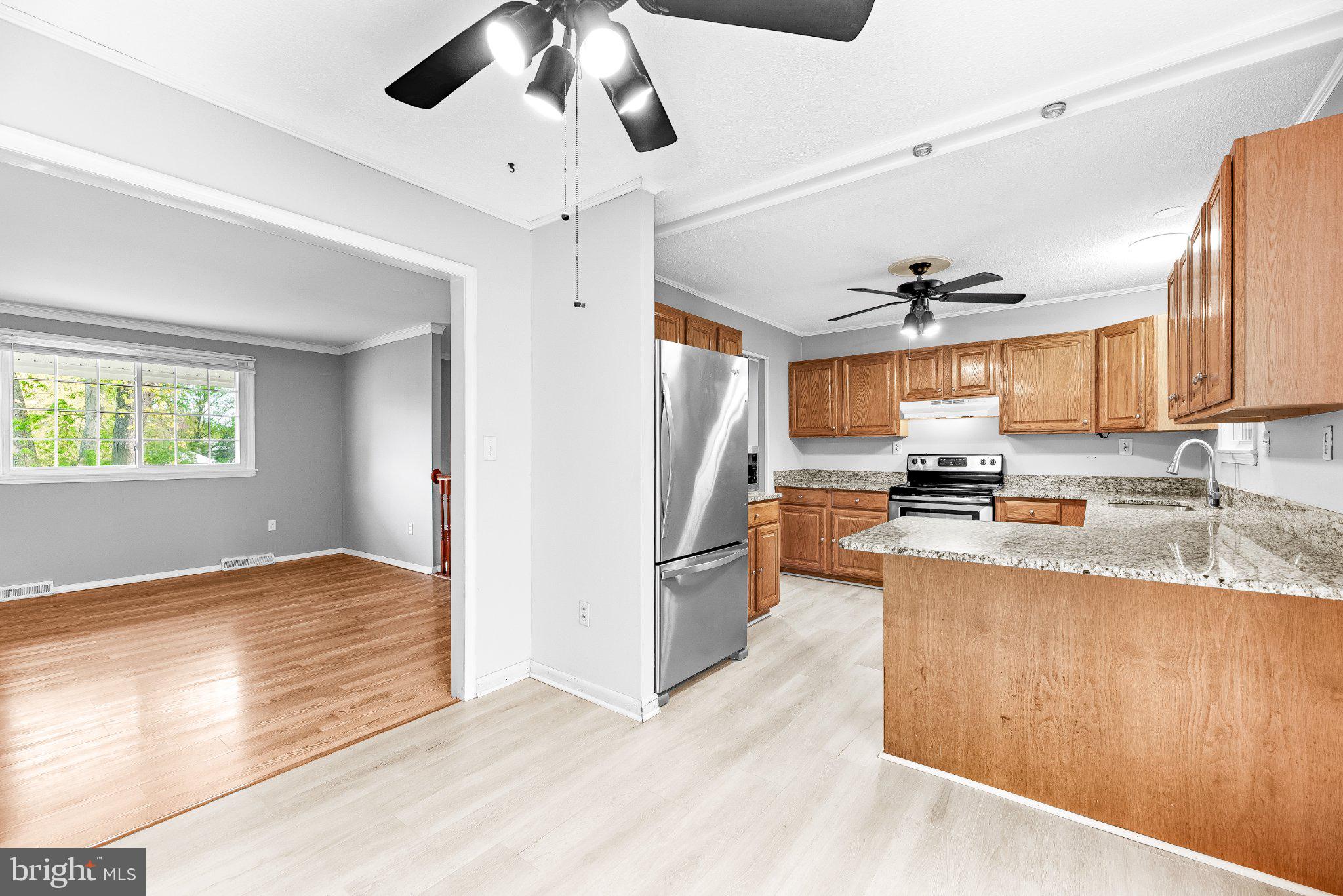 11951 Prince Court Dunkirk, MD 20754 - Photo 16 of 72 a kitchen with stainless steel appliances granite countertop a refrigerator and a sink