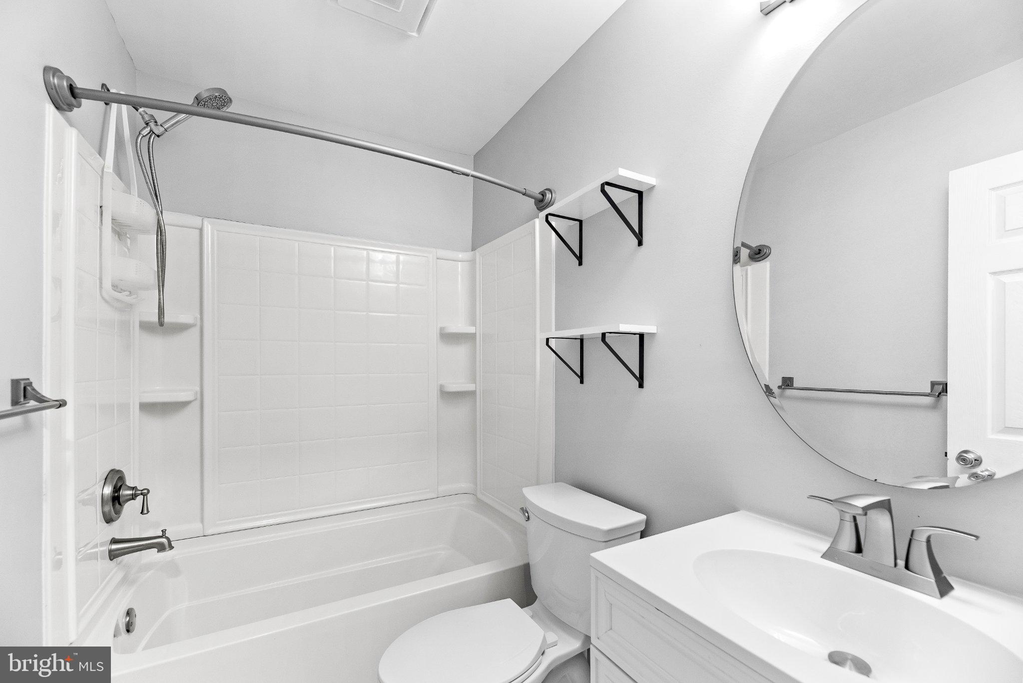 11951 Prince Court Dunkirk, MD 20754 - Photo 19 of 72 a bathroom with a sink toilet and a bathtub