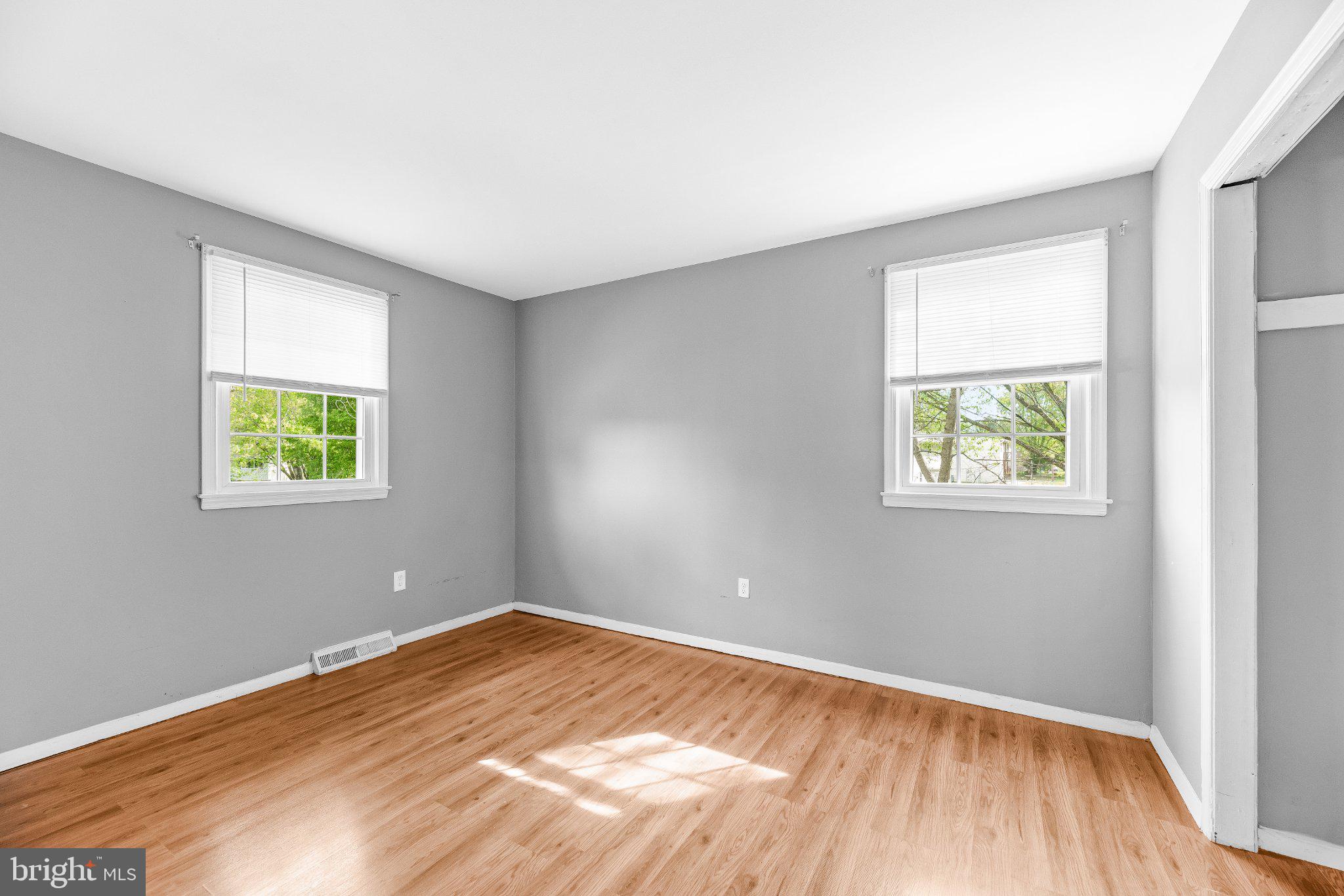 11951 Prince Court Dunkirk, MD 20754 - Photo 22 of 72 an empty room with wooden floor and windows