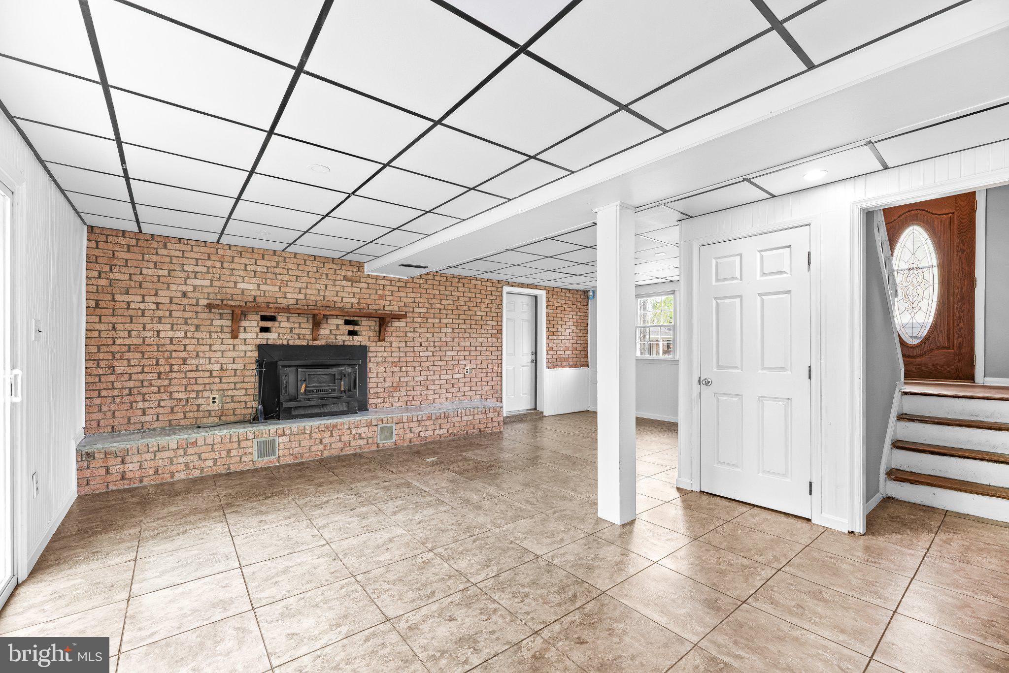 11951 Prince Court Dunkirk, MD 20754 - Photo 24 of 72 a view of entryway with a brick wall and a fireplace