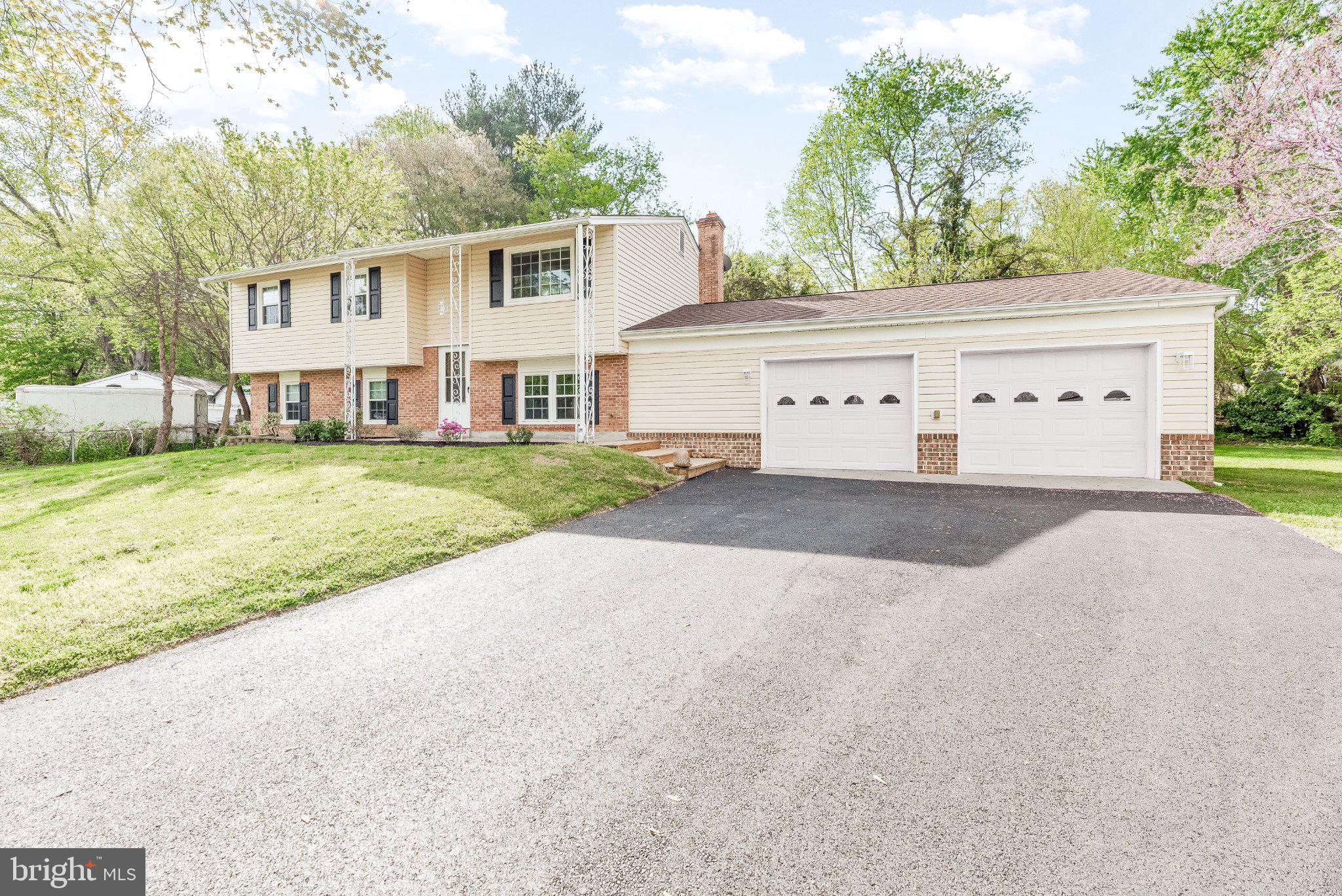 11951 Prince Court Dunkirk, MD 20754 - Photo 5 of 72 a front view of a house with a yard and garage
