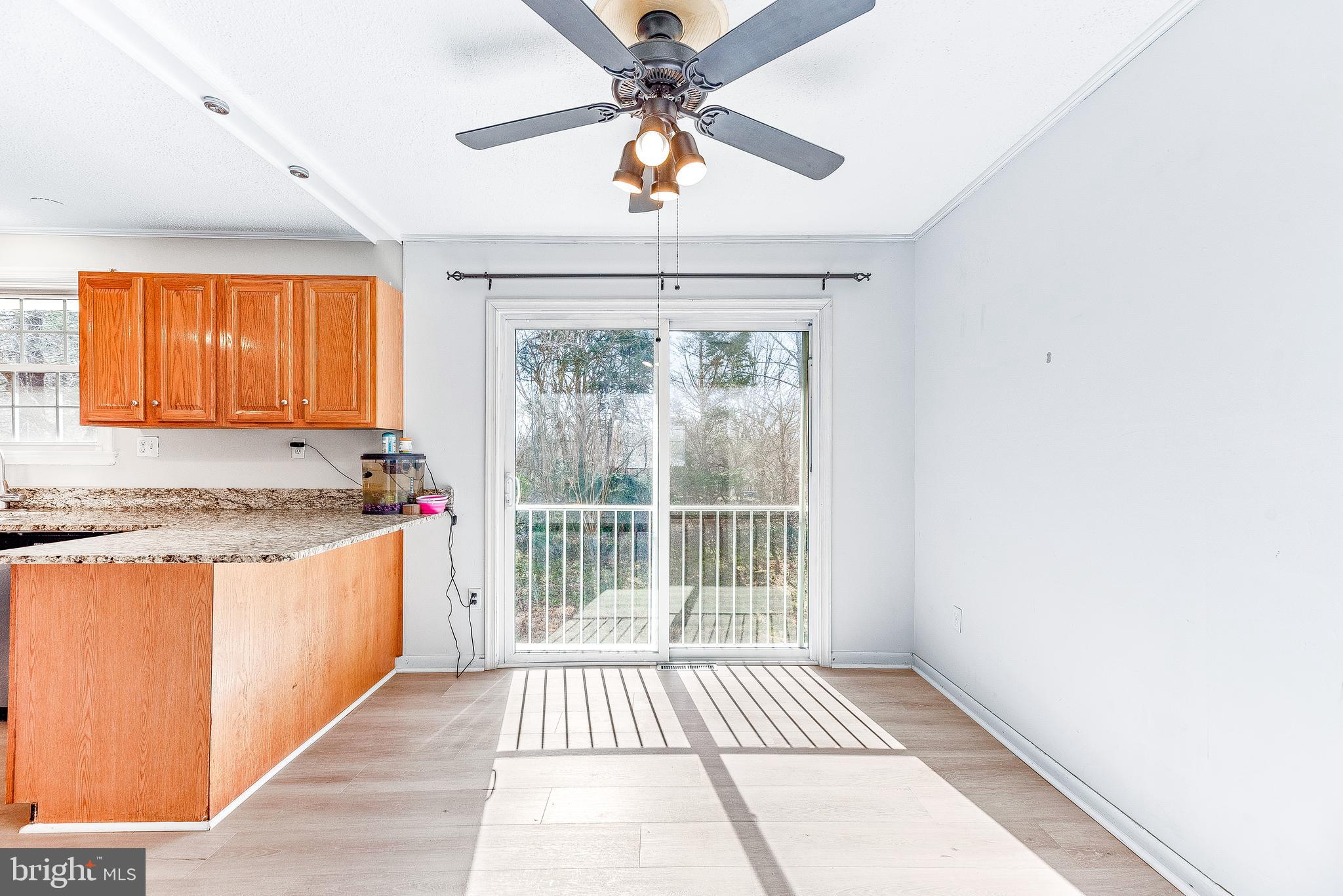 11951 Prince Court Dunkirk, MD 20754 - Photo 51 of 72 a view of kitchen with granite countertop cabinets and outdoor space