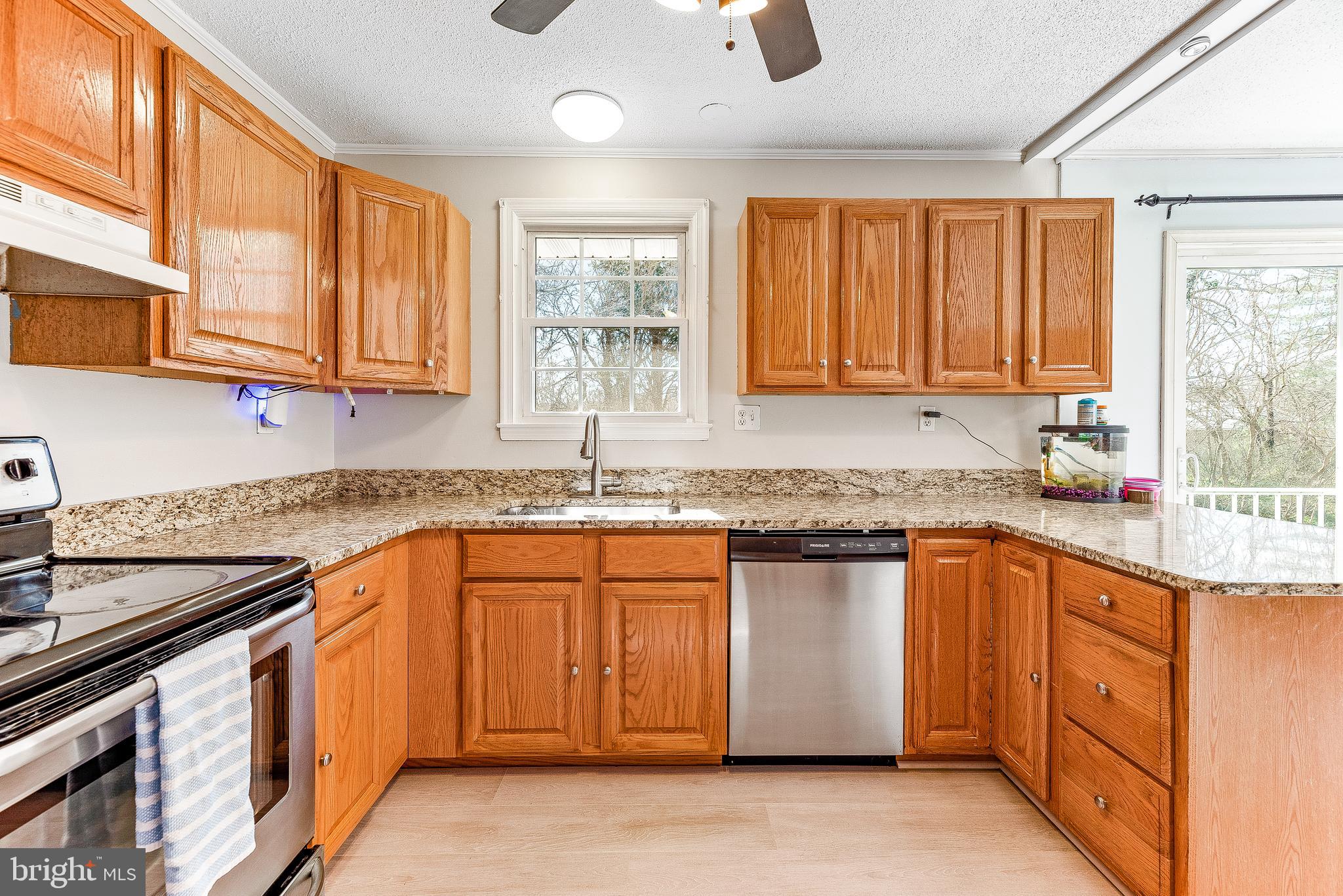 11951 Prince Court Dunkirk, MD 20754 - Photo 55 of 72 a kitchen with stainless steel appliances granite countertop a sink stove and refrigerator
